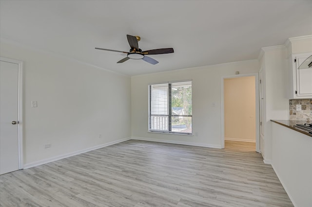 715 Gentlewind Ln, Martinez, GA 30907 - unfurnished living room with ceiling fan, crown molding, and light wood-type flooring
