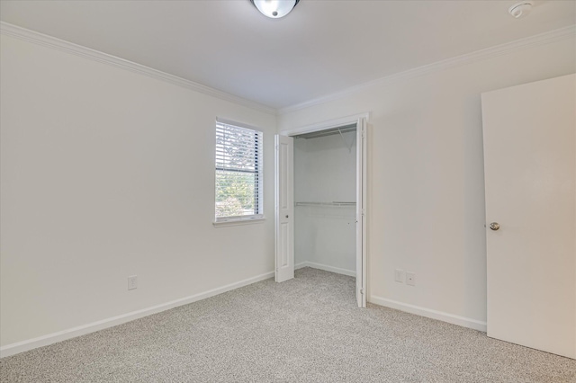 715 Gentlewind Ln, Martinez, GA 30907 - unfurnished bedroom with crown molding, light colored carpet, and a closet