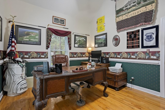 office space featuring hardwood / wood-style flooring and vaulted ceiling