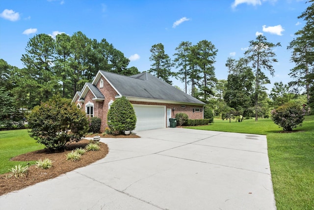 view of front of house featuring a garage and a front lawn