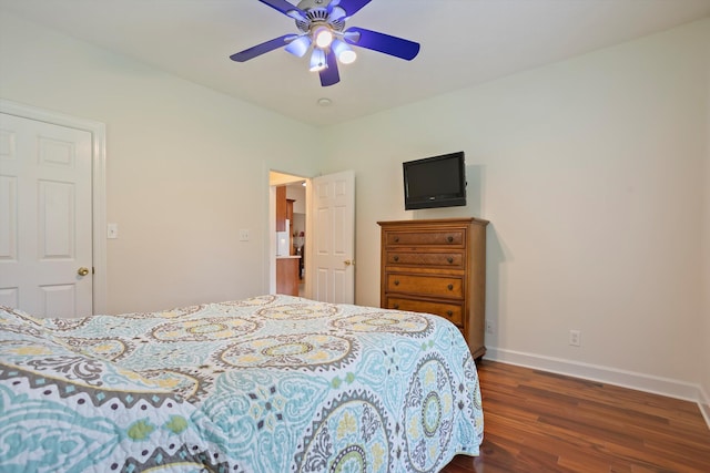 bedroom with ceiling fan and dark hardwood / wood-style floors