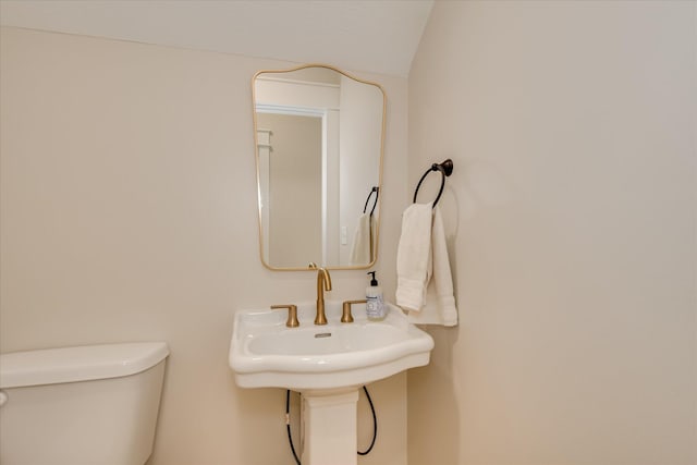 half bath featuring toilet