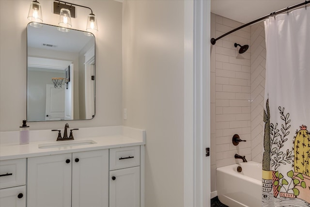 bathroom with vanity, visible vents, and shower / bath combination with curtain