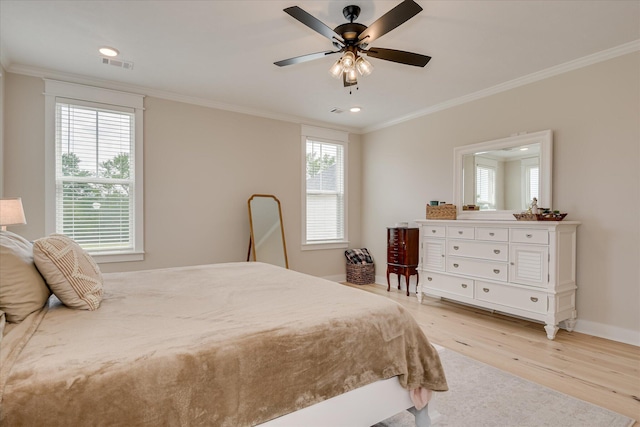 bedroom with visible vents, ornamental molding, baseboards, recessed lighting, and light wood-style flooring