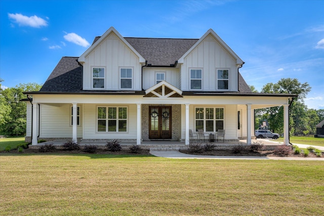 view of front facade featuring french doors, covered porch, board and batten siding, and a front lawn