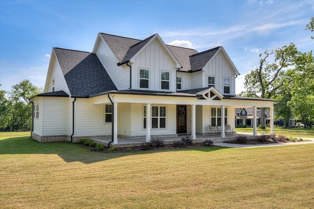 modern farmhouse style home with roof with shingles, covered porch, board and batten siding, and a front lawn