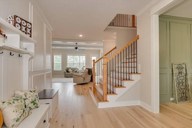 interior space featuring baseboards, a ceiling fan, recessed lighting, and wood finished floors