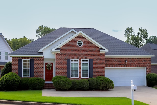 view of front of house featuring a front yard and a garage