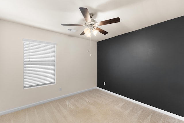 carpeted empty room with ceiling fan