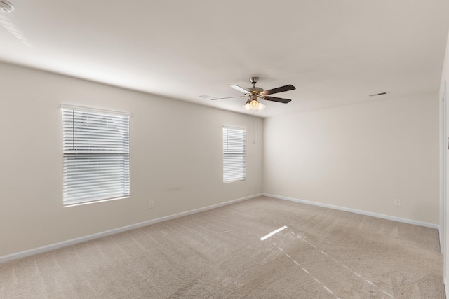 carpeted empty room with ceiling fan