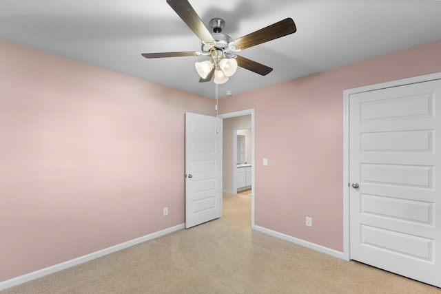 unfurnished bedroom featuring ceiling fan and light carpet