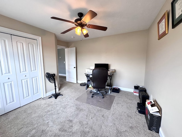 office area featuring carpet, ceiling fan, and baseboards