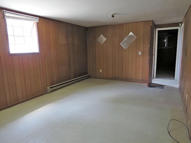 3414 Applejack Ter, Augusta, GA 30906 - unfurnished room with a baseboard radiator, wooden walls, and light colored carpet
