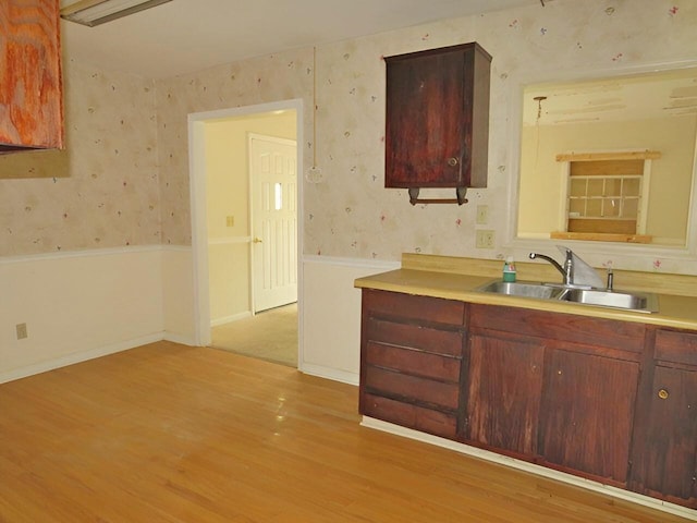 3414 Applejack Ter, Augusta, GA 30906 - kitchen featuring wallpapered walls, light wood-style floors, and light countertops