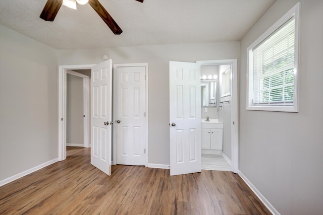 3204 Hillis Rd, Augusta, GA 30906 - unfurnished bedroom featuring wood finished floors, ensuite bathroom, a closet, and a ceiling fan