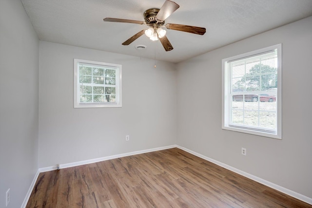 3204 Hillis Rd, Augusta, GA 30906 - empty room featuring healthy amount of natural light, wood finished floors, and ceiling fan