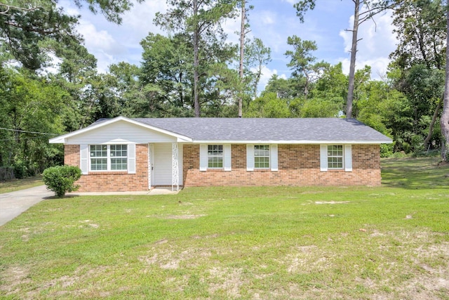 3204 Hillis Rd, Augusta, GA 30906 - ranch-style home with brick siding, a front yard, and view of scattered trees