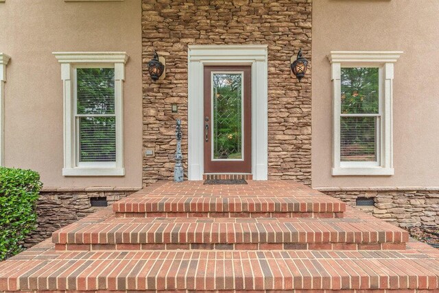 3287 Surrey Rd, Thomson, GA 30824 - view of exterior entry with stone siding and stucco siding