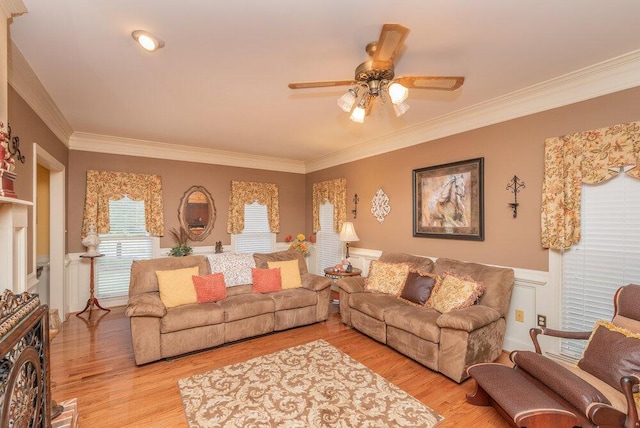 3287 Surrey Rd, Thomson, GA 30824 - living room with wainscoting, ceiling fan, ornamental molding, and light wood finished floors