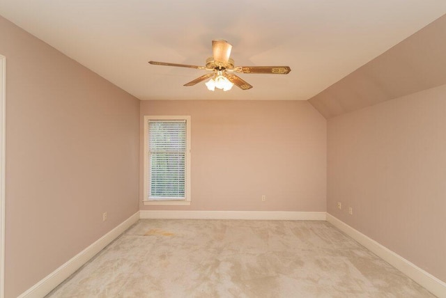 3287 Surrey Rd, Thomson, GA 30824 - spare room with baseboards, ceiling fan, vaulted ceiling, and light carpet