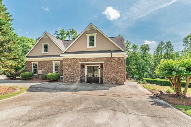 3287 Surrey Rd, Thomson, GA 30824 - craftsman-style house with french doors, stone siding, and stucco siding
