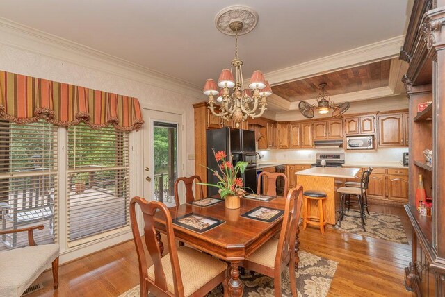 3287 Surrey Rd, Thomson, GA 30824 - dining area featuring crown molding, a chandelier, and light wood finished floors