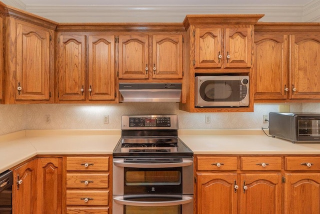 3287 Surrey Rd, Thomson, GA 30824 - kitchen with light countertops, brown cabinetry, stainless steel appliances, a toaster, and under cabinet range hood