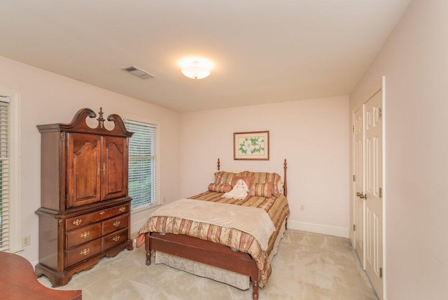 3287 Surrey Rd, Thomson, GA 30824 - bedroom with light colored carpet, baseboards, and visible vents