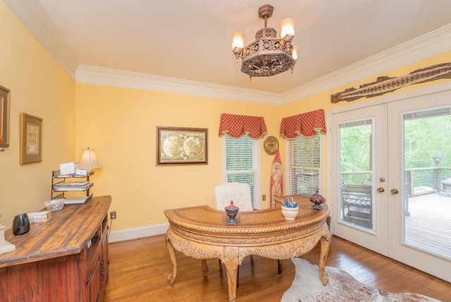 3287 Surrey Rd, Thomson, GA 30824 - dining room featuring crown molding, french doors, light wood finished floors, and a notable chandelier