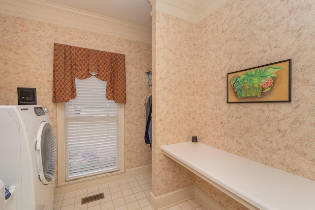 3287 Surrey Rd, Thomson, GA 30824 - bathroom with visible vents, tile patterned flooring, baseboards, washer / dryer, and ornamental molding