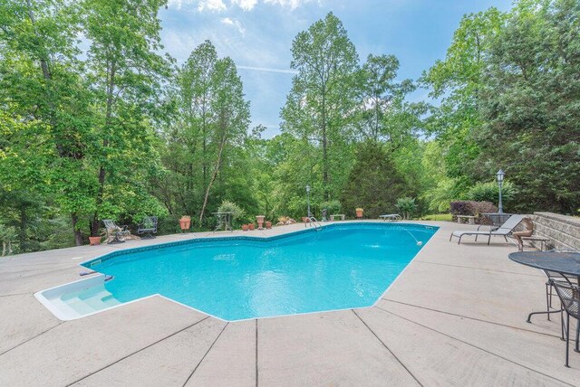 3287 Surrey Rd, Thomson, GA 30824 - outdoor pool featuring a patio area