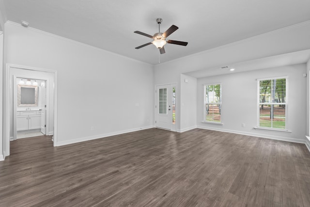 unfurnished living room featuring ceiling fan, crown molding, and dark hardwood / wood-style flooring