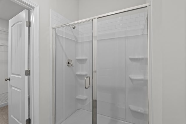 bathroom with an enclosed shower