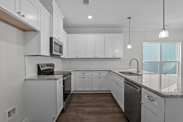 kitchen with pendant lighting, sink, white cabinetry, stainless steel appliances, and kitchen peninsula