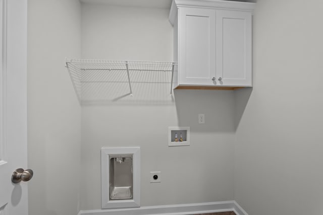 laundry area with cabinets, washer hookup, and hookup for an electric dryer