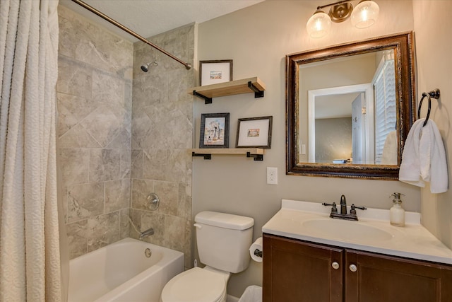 full bathroom with shower / tub combo with curtain, vanity, and toilet
