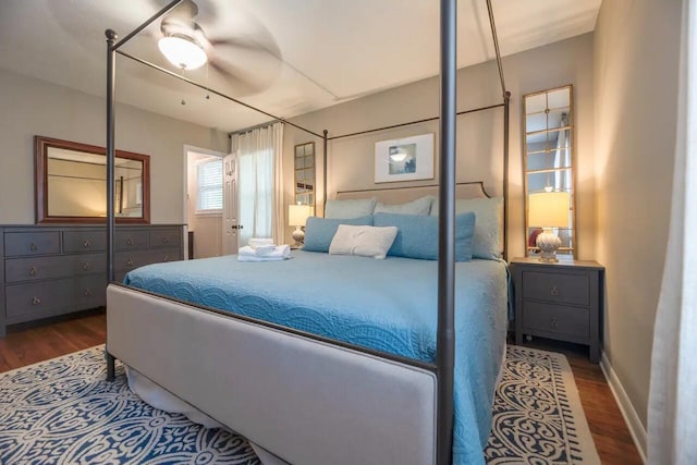 bedroom featuring dark wood-style flooring and a ceiling fan