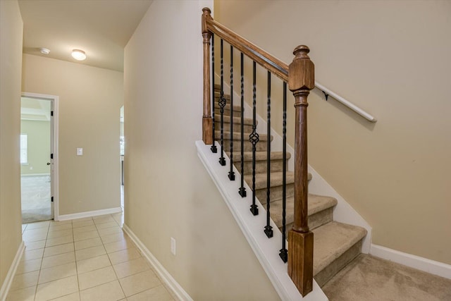 stairs with tile patterned floors