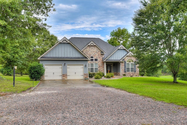 craftsman-style house featuring a garage and a front yard