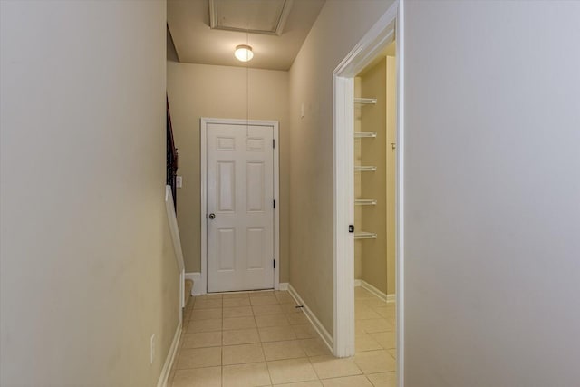 hallway featuring light tile patterned floors