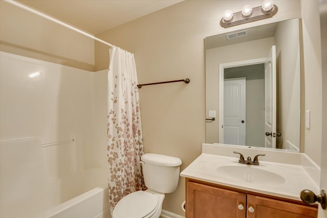 full bathroom with shower / bath combo, vanity, and toilet