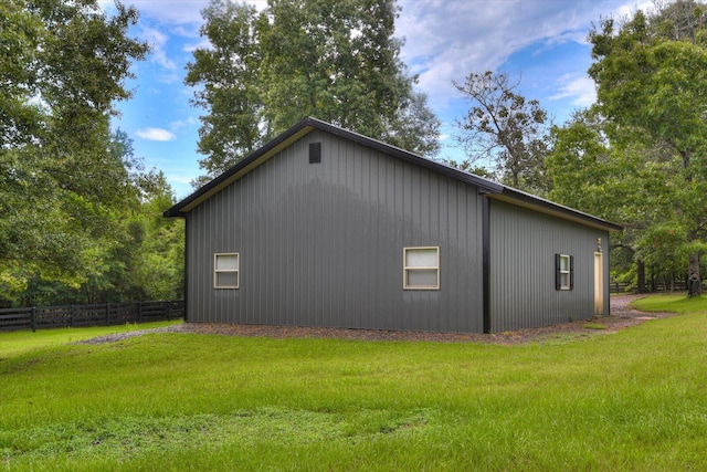 view of property exterior with a lawn