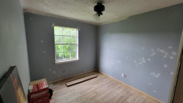 empty room with hardwood / wood-style floors