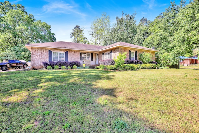 2530 Springwood Dr, Augusta, GA 30904 - ranch-style home featuring a porch, brick siding, and a front yard