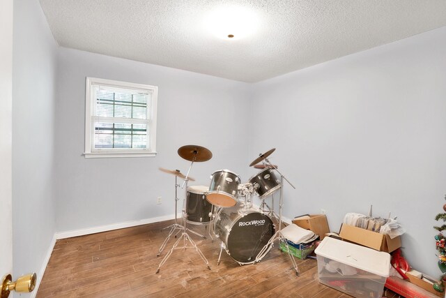 2530 Springwood Dr, Augusta, GA 30904 - misc room with baseboards, wood finished floors, and a textured ceiling