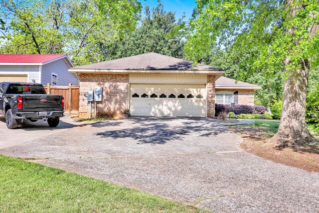 2530 Springwood Dr, Augusta, GA 30904 - ranch-style house featuring brick siding, an attached garage, aphalt driveway, and fence