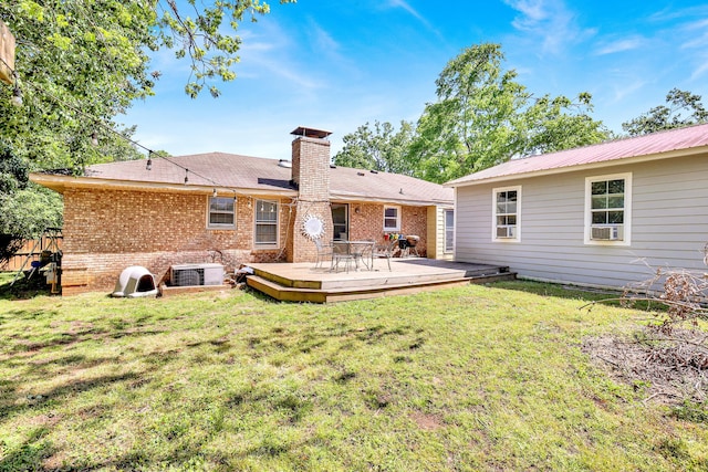 2530 Springwood Dr, Augusta, GA 30904 - back of house featuring central AC unit, a chimney, a lawn, a deck, and brick siding