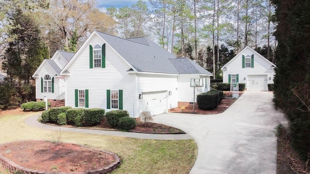 view of side of home featuring roof with shingles, crawl space, an outdoor structure, and a lawn