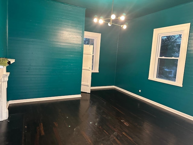 unfurnished room with hardwood / wood-style floors