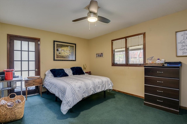 carpeted bedroom with multiple windows, a ceiling fan, and baseboards